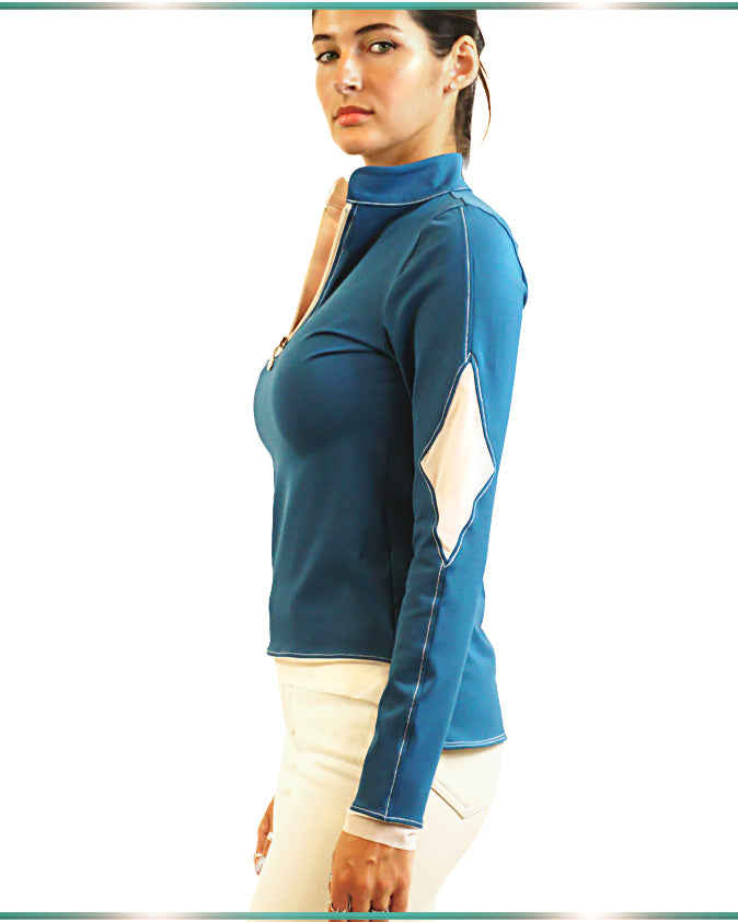 A model wearing Uvimati, blue and white blouse poses facing sideways..
