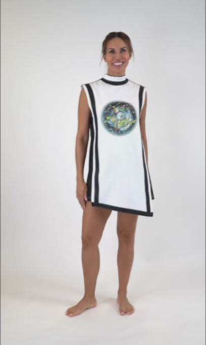 Model wearing white and black short, asymmetrical dress on the video showing 360º of the dress